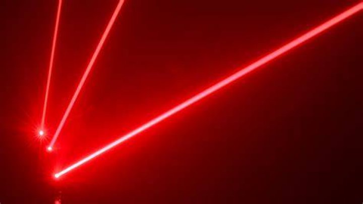 Why can't we see a laser beam going across the room?